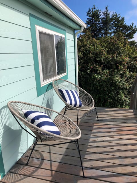 Lounge chairs in front of the house.