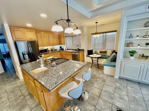 Kitchen with large island and all new luxurious stainless steel appliances.