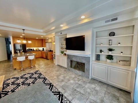 Living room with large sectional couch and smart tv