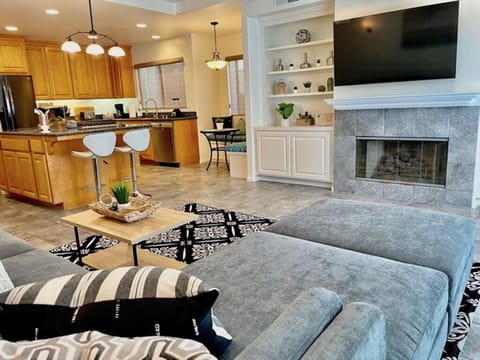 Living room with large sectional couch and smart tv