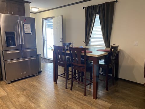 Dining room table seats 4 comfortably.