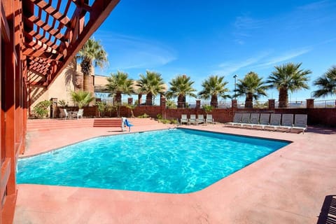 Dive into sunshine and unwind beside the sparkling pool.