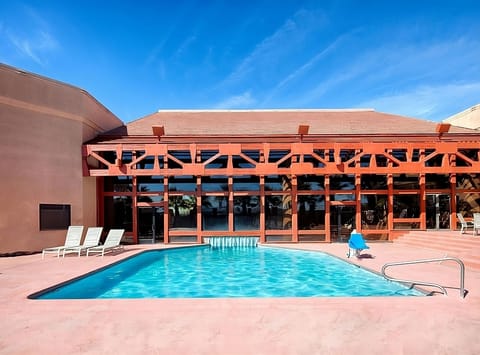 Dive into sunlit serenity with refreshing poolside lounging.
