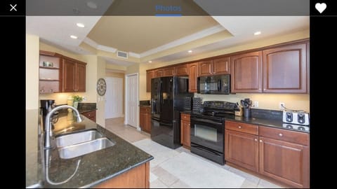 Large fully equipped kitchen with ocean view and breakfast bistro set. 