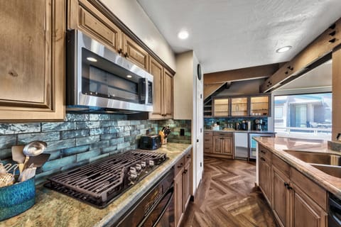 Numerous small appliances in the fully stocked kitchen