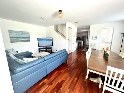 Open living area features a BRAND NEW Leather (easy to clean!) sectional, oversized chair around a large Smart TV. The light and bright dining space has a large dining table.