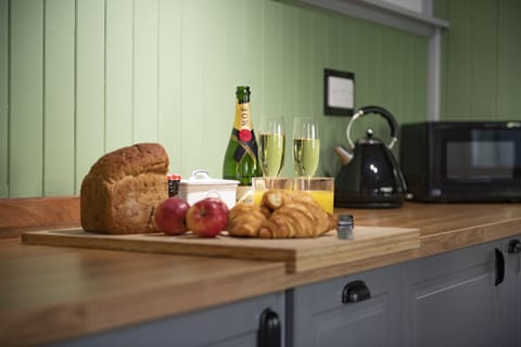 Ground floor: Delightful cottage kitchen with Belfast sink overlooking the patio area