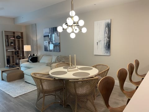 Dining room table fits 4; bar seating at kitchen island seats 4
