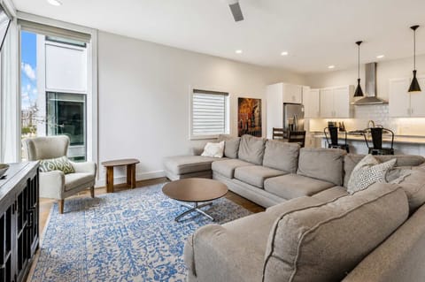 Cozy up with friends on the L-shaped sectional and admire the views.