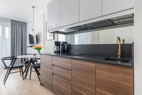 Functional kitchen with wooden cabinets and modern appliances.

