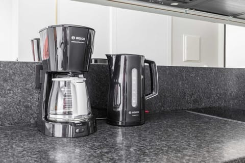 Coffee and tea corner with modern equipment for your convenience.