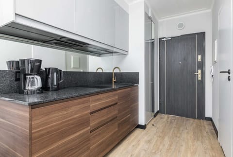 Functional kitchen with wooden cabinets and modern appliances.

