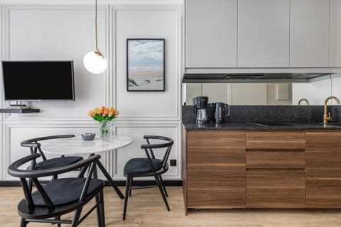 Dining area connected to a fully equipped kitchen
