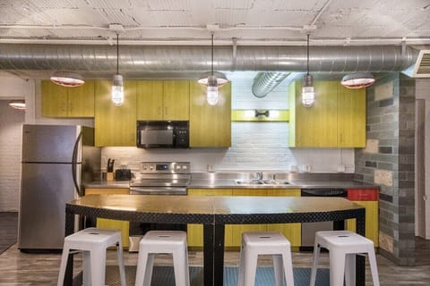 A full kitchen outfitted with the appliances and cookware you need for a meal at home.