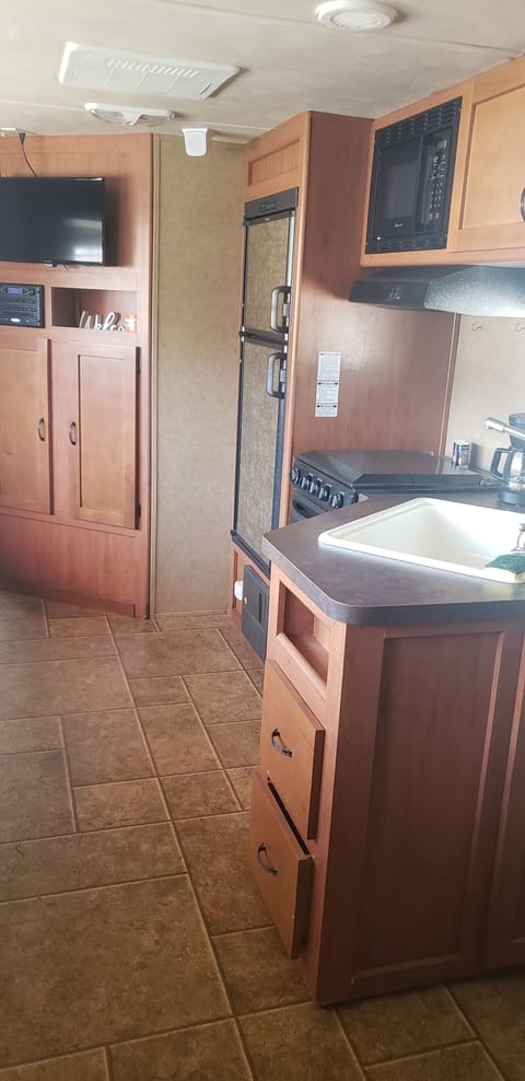 kitchen area/ living room with tv