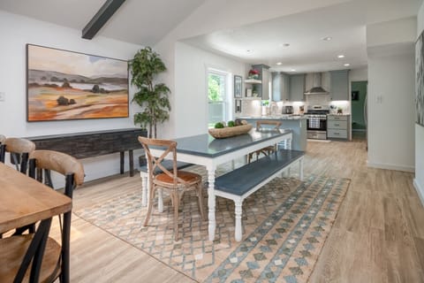 Bright dining space opens seamlessly into the fully stocked kitchen — ideal for family meals or entertaining