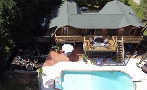 Fire pit, pool, pool deck, screened-in porch, and second-level deck