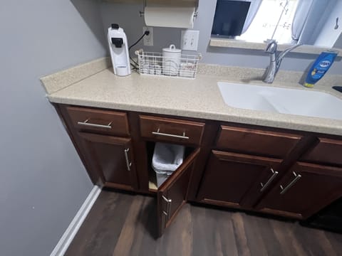 Trash can & K-cup machine -varieties provided with creamer and sugar. 