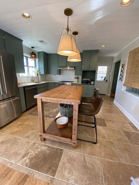 Spacious fully stocked kitchen complete with high end KitchenAid appliances!