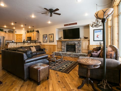 Living room with Huge Smart TV and Sonos sound system.