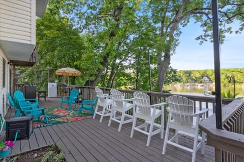 Bar height Adirondack Chairs with wonder view of the lake of the deck. 