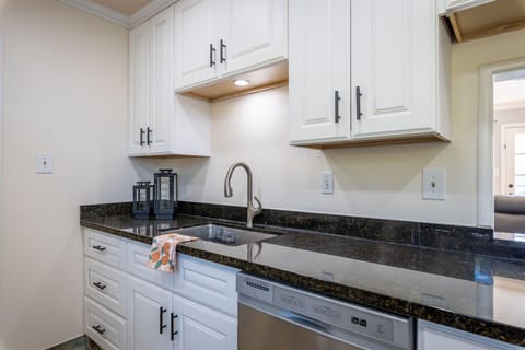 Modern kitchen sink with built-in drawers and dishwasher