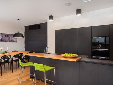 Property, Furniture, Table, Lighting, Wood, Orange, Interior Design, Countertop, Home Appliance, Flooring