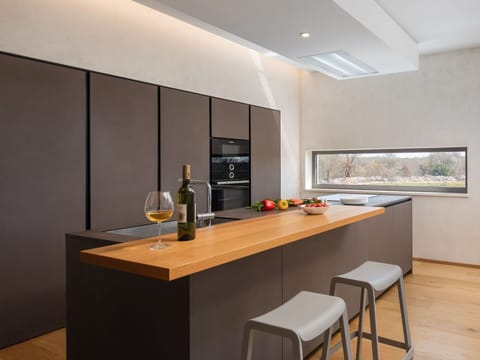 Cabinetry, Furniture, Property, Table, Countertop, Building, Wood, Bottle, Interior Design, House