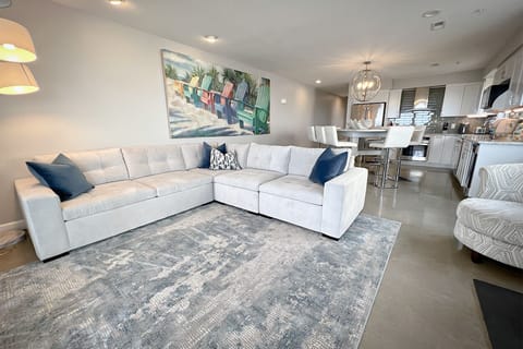 Modern and sleek, with a seamless transition between the cozy living room and elegant dining area.