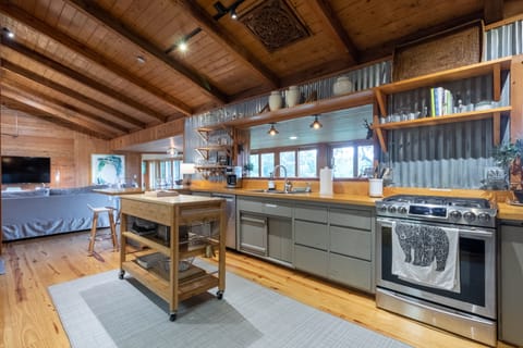 Fully equipped kitchen with gas range and modern stainless appliances