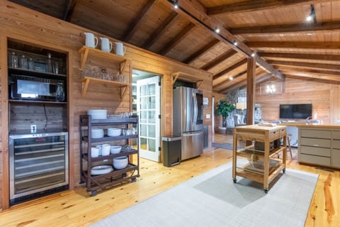 Wine fridge, and plenty of place settings and glassware on hand!