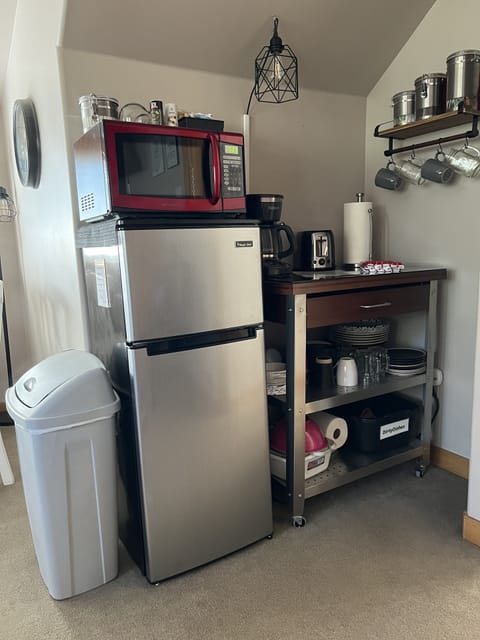 Small area to cook/heat meals. Coffee, hot water kettle and microwave. No Stove