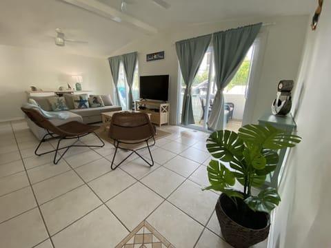 Living room-hurricane proof sliding doors, blackout curtains, satellite TV, WIFI