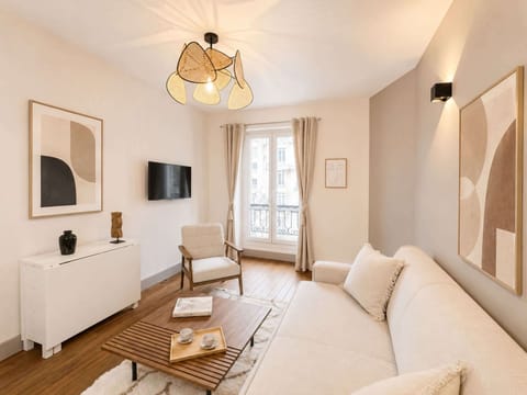 The living area includes a sofa, HD TV, and high-speed Wi-Fi for your use.