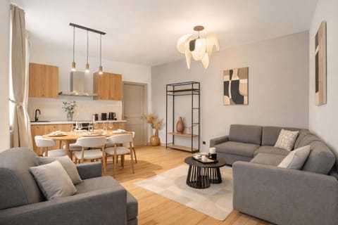 The bright living room opens onto the kitchen. 