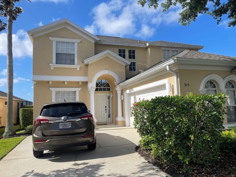 Front of Villa, with ample room for three vehicles. Lighting and Ring Camera 