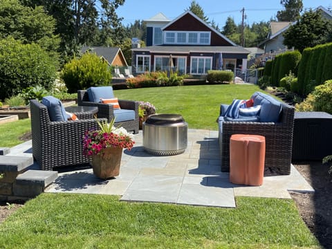 Patio overlooking Saratoga Passage. Firepit not available during burn bans.