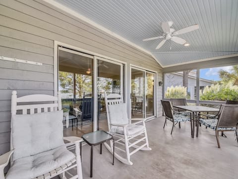 Screened Porch with Dining Table at 35 Lands End