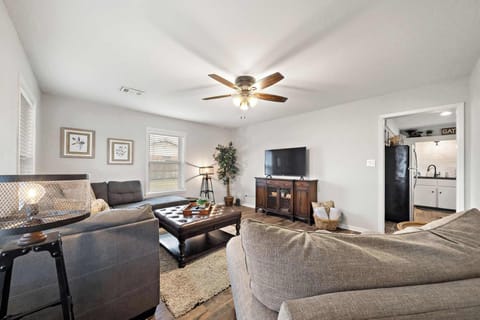 Living Room: Bright and inviting space with plush seating, perfect for lively gatherings.