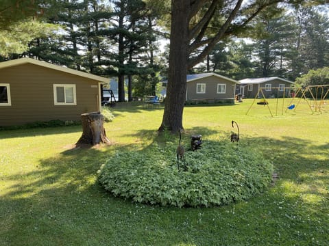 Sams Place Lawn and 3 cabins along lake, cabin 2 is the middle one.