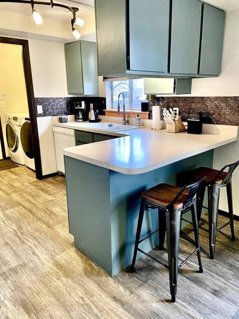 Kitchen and view to Washer/Dryer
