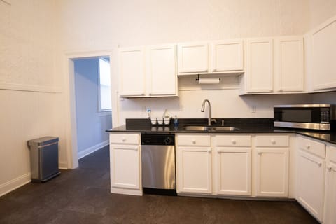 Spacious kitchen with stainless steel appliances.