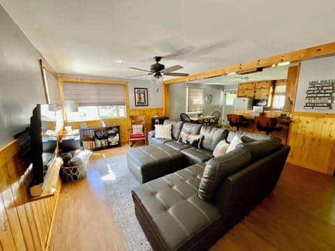 Plenty of seating on the L shaped couch &  ottoman, 55" TV, and sound bar