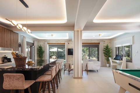 Open plan living - kitchen area with direct access to the pool and garden