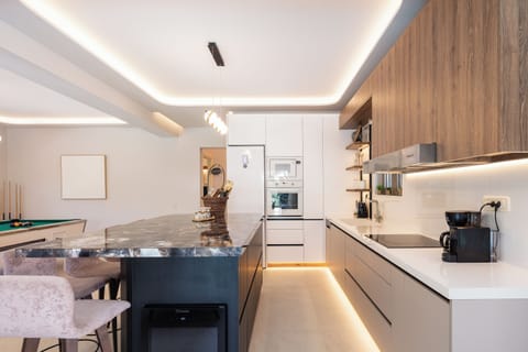 The kitchen is fully equipped with modern appliances, making a self-catered holiday effortless and enjoyable.