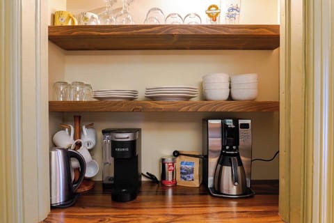 Coffee and tea bar. Drip coffee maker,  coffee grinder, and Keurig.  We provide one bag of coffee beans & a variety of coffee K cups & tea bags.