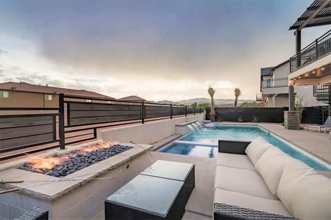 Poolside fire pit conversation area with comfortable seating