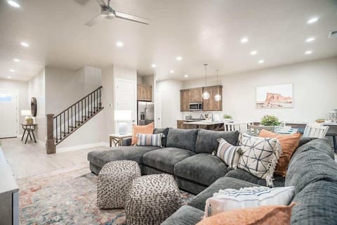 Comfortable sectional in family room open to kitchen