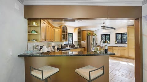 View of the spacious kitchen from the bar area.