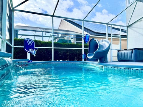 Private Outdoor Pool with your entertaining waterfalls and eclectic lighting shining over your favority pool baskelball hoop or slide down the water slide, sit back in the hot tub before sipping on your fine glass of wine in front of the Fire Pit.
